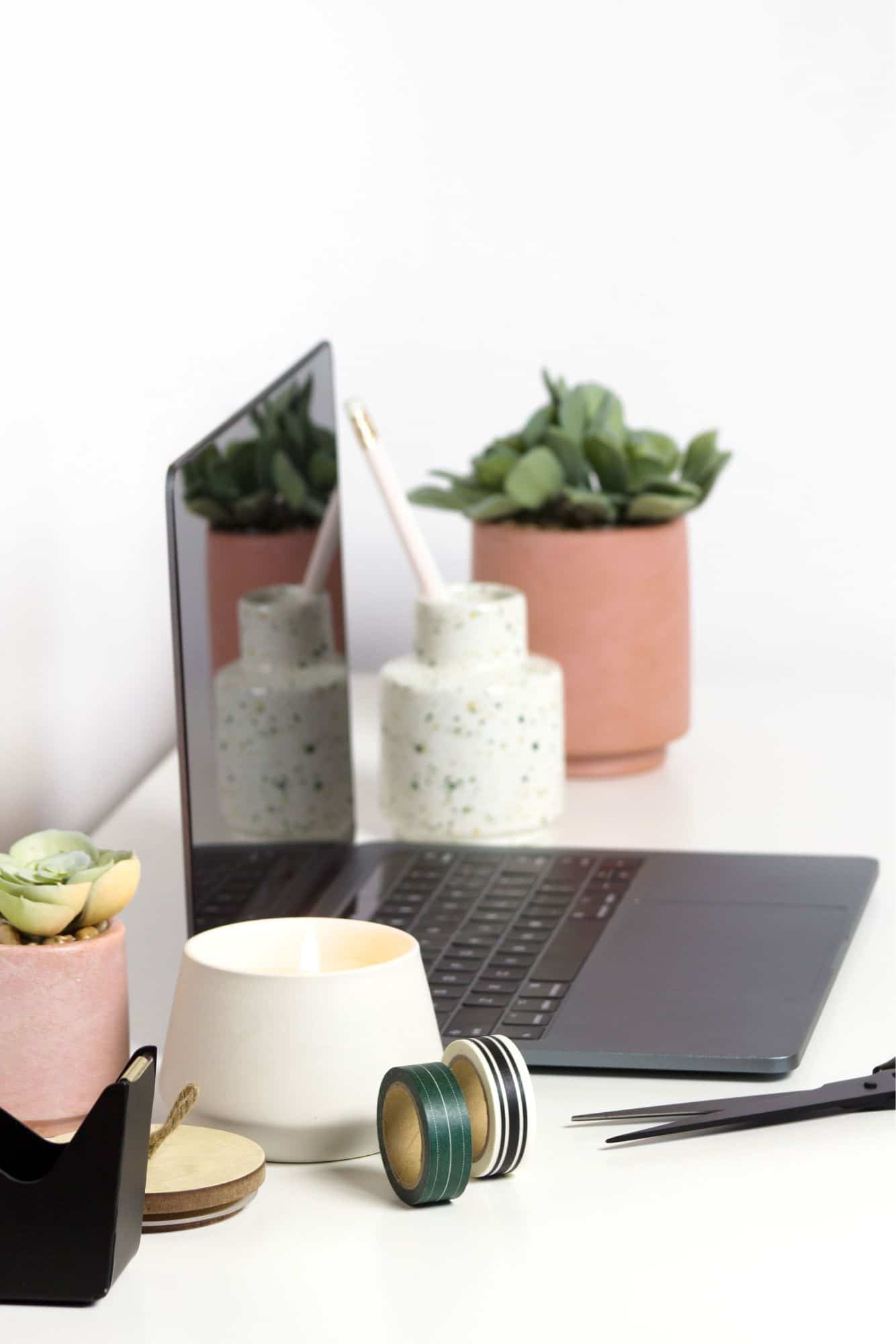 virtual assistant home office desk with laptop computer